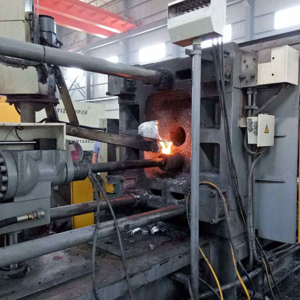 Aluminum being injected into a steel mold under high pressure